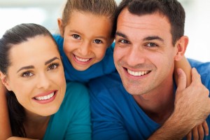 Smiling Family of Three