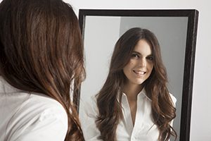 Woman Looking into Mirror