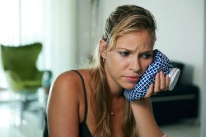 Woman Experiencing Dental Emergency