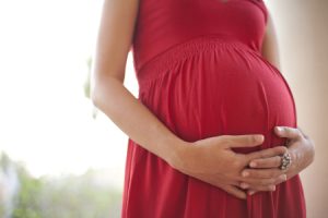 Pregnant Woman Touching Her Belly